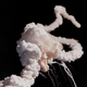 Immediately after the explosion, the still-burning solid rocket boosters made corkscrew trails as they flew away from the explosion of the external fuel tank (NASA)
